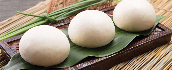 Plate of foodservice Amoy Asian Char Siu Bao in a restaurant setting