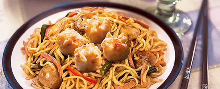 Plate of foodservice Amoy Asian Shaomai Lo Mein in a restaurant setting