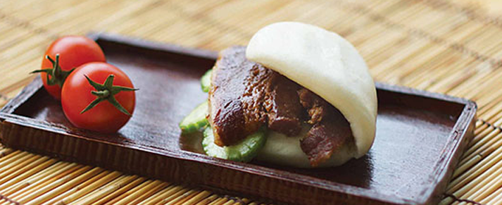 Pate of foodservice Amoy Asian Pork Belly Bao in a restaurant setting