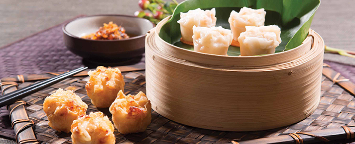 Basket of foodservice Amoy Asian Shrimp Shaomai in a restaurant setting