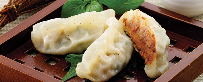 Plate of foodservice Amoy Asian Gourmet Potstickers in a restaurant setting